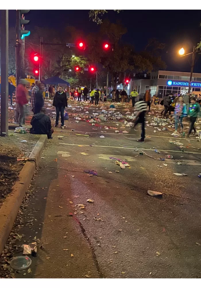 Trash-lined street after Mardi Gras parade in New Orleans