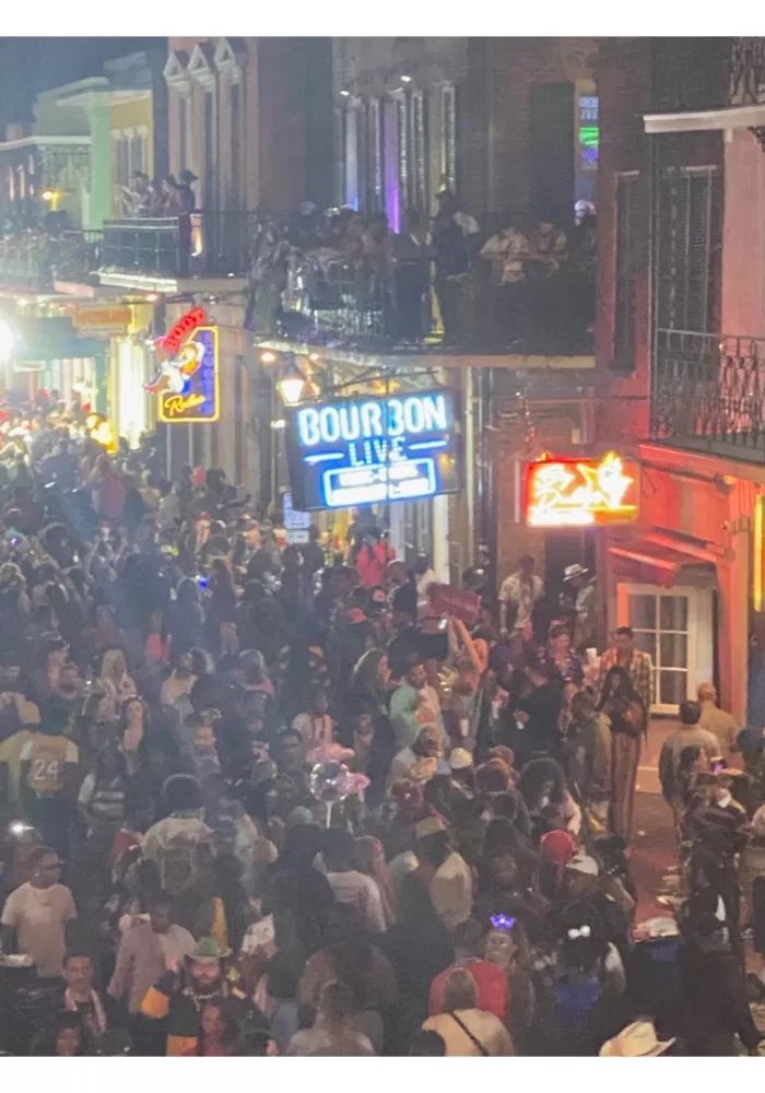 huge crowd on Bourbon Street at Mardi Gras at night