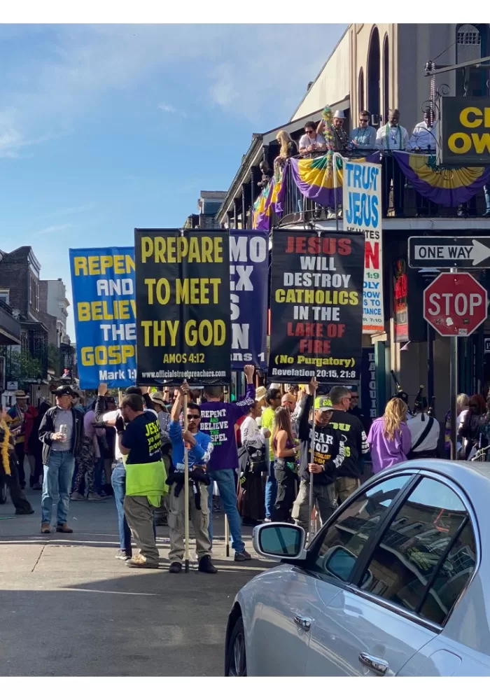 Christian protest signs at Mardi Gras. "Prepare to meet thy God."