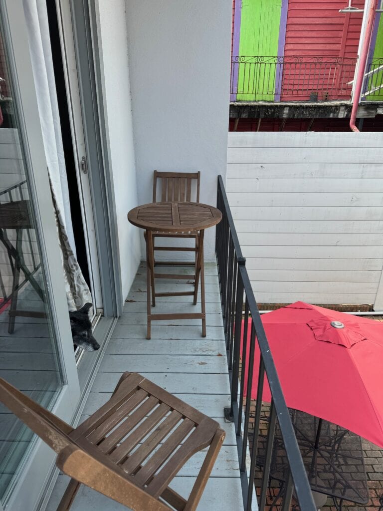 Small balcony with table and chairs