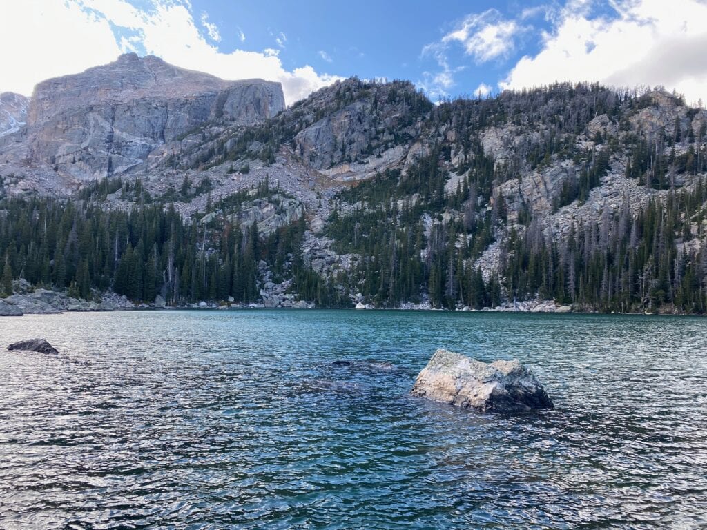 Mountains behind a turquoise lake