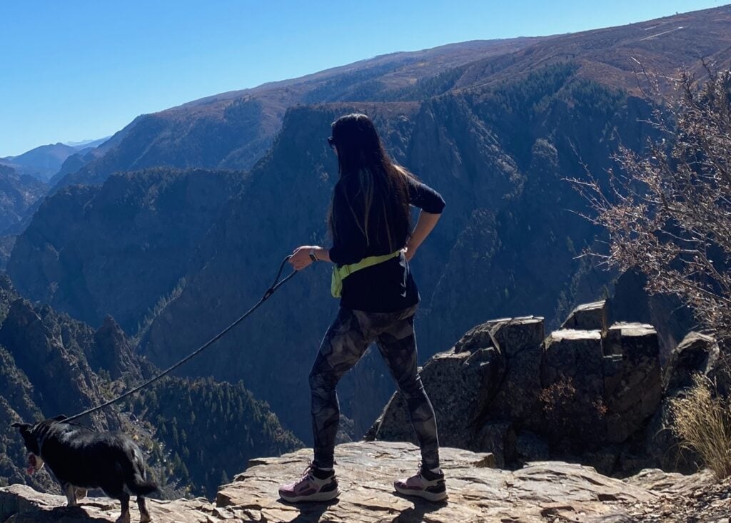 Woman with dog overlooking Black Canyon of the Gunnison