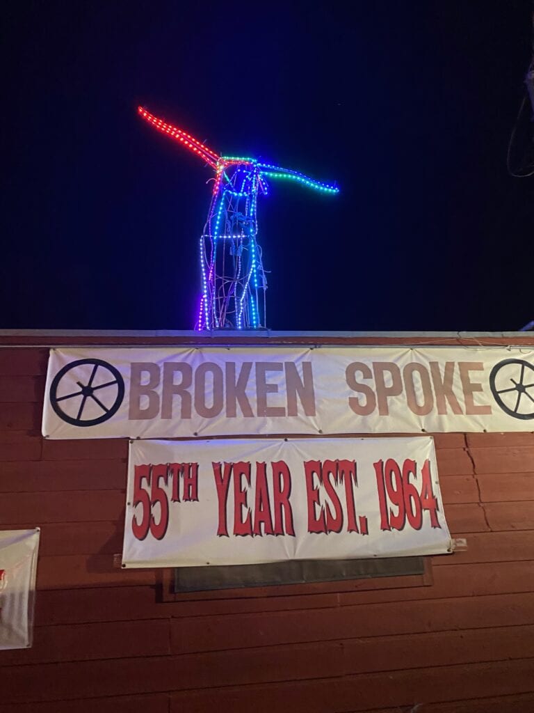 Outside of Broken Spoke in Austin, TX. Neon bull atop the roof