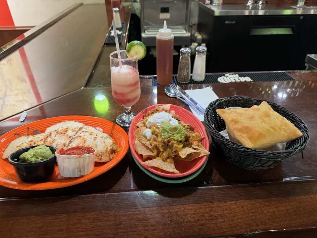 nachos, quesadilla, and red and white swirly margarita