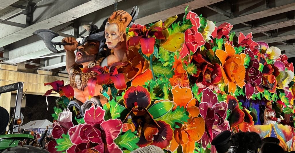 colorful parade float of a woman with flowers at Mardi Gras