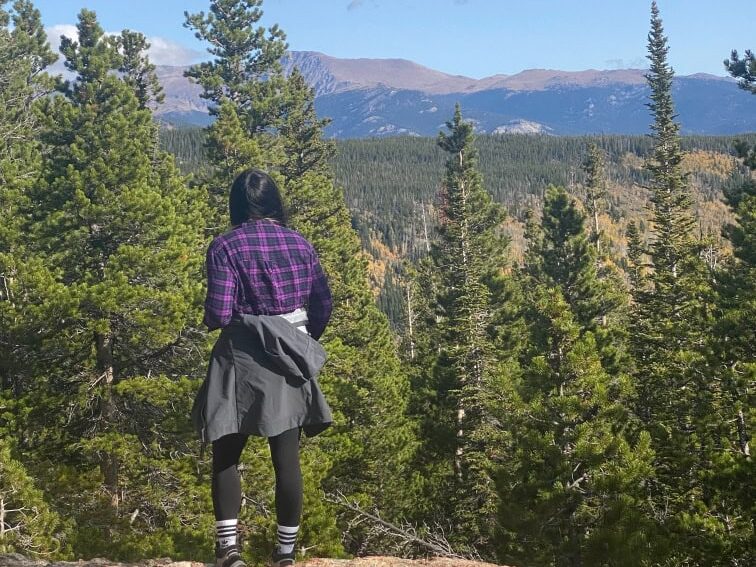 Woman looking out over mountains