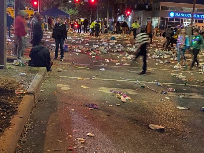 Trash-lined street after Mardi Gras parade in New Orleans