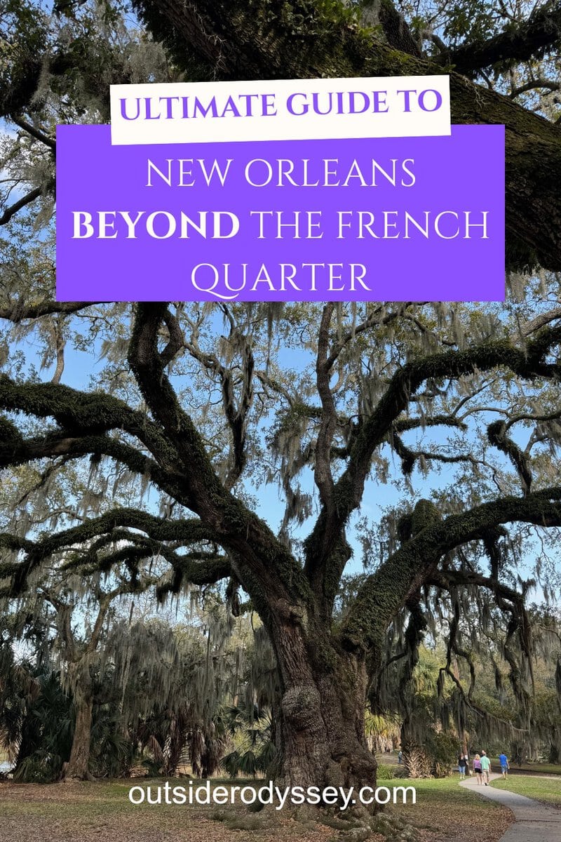 A large oak tree draped with Spanish moss stands in a park, with people strolling in the background. Overlaid text reads, Ultimate Guide to Things to Do in New Orleans Outside the French Quarter, and outsiderodyssey.com at the bottom.