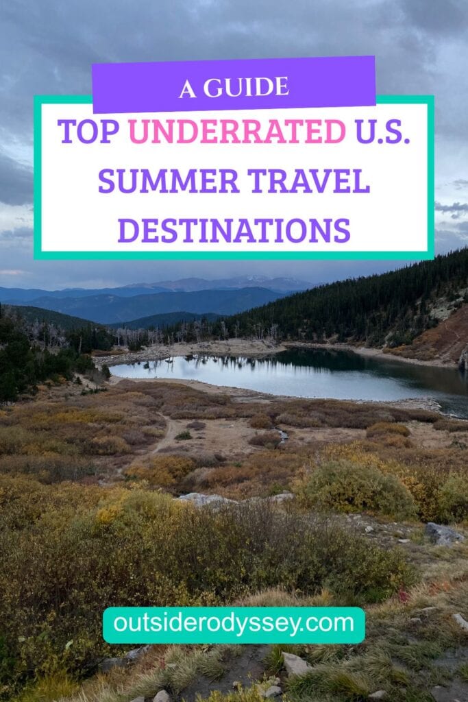 Lake surrounded by green hills under a cloudy sky, with text overlay: A Guide: Top Underrated Summer Destinations in the USA. Website: outsiderodyssey.com.